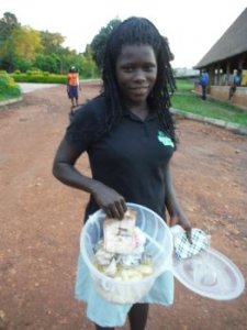Dorcus showing off her cassava chips she has made for sale.