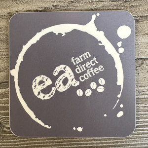 Ea Coaster with Ea Logo inside a coffee stain graphic