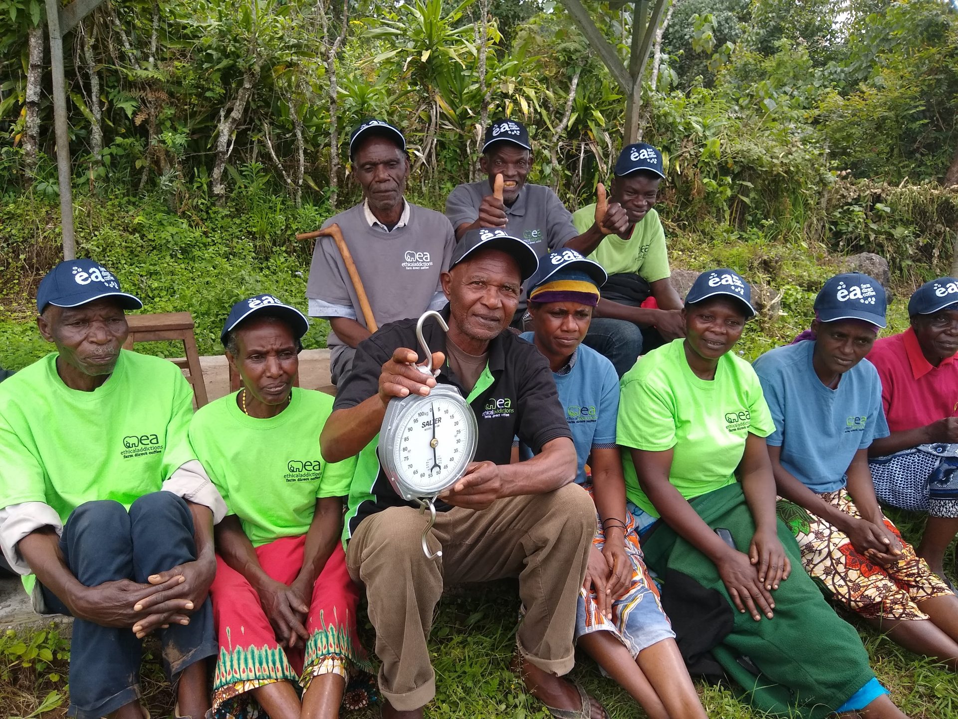 Villagers at the orera villages showing off their new scales donated bu Ethical Addictions